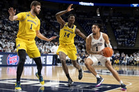 Hunter Dickinson (1) and Moussa Diabate (14)