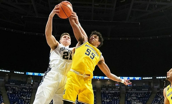 Eli Brooks (55) and DeVante' Jones (12)
