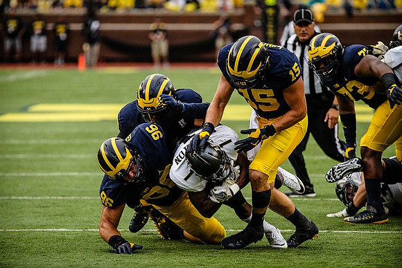 Ryan Glasgow (96), Chase Winovich (15), and Maurice Hurst (73)