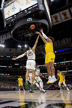 Zavier Simpson (3), Isaiah Livers (4), and Charles Matthews (1)