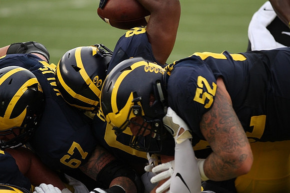Kyle Kalis (67), Khalid Hill (80), and Mason Cole (52)
