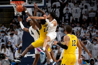 Moussa Diabate (14) and DeVante' Jones (12)