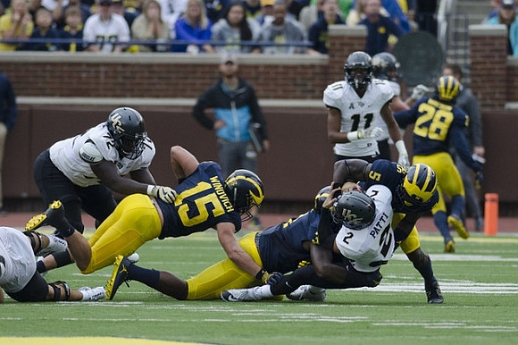 Chase Winovich (15), Jeremy Clark (34), Jabrill Peppers (5), and Brandon Watson (28)
