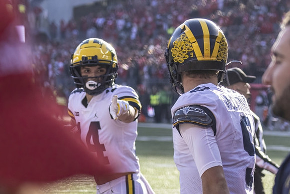 Roman Wilson (14) and J.J. McCarthy (9)