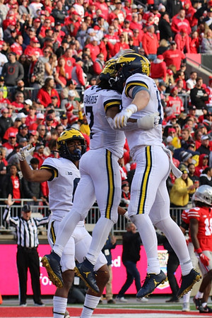 Cornelius Johnson (6), Donovan Edwards (7), and Colston Loveland (18)