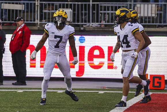 Donovan Edwards (7) and Roman Wilson (14)
