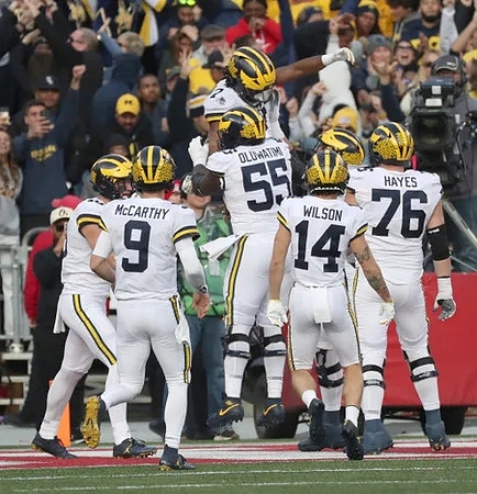 Colston Loveland (18), J.J. McCarthy (9), Olusegun Oluwatimi (55), Donovan Edwards (7), Roman Wilson (14), and Ryan Hayes (76)