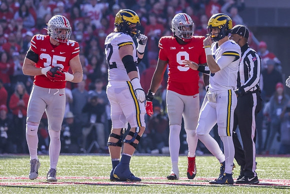 Karsen Barnhart (52) and J.J. McCarthy (9)