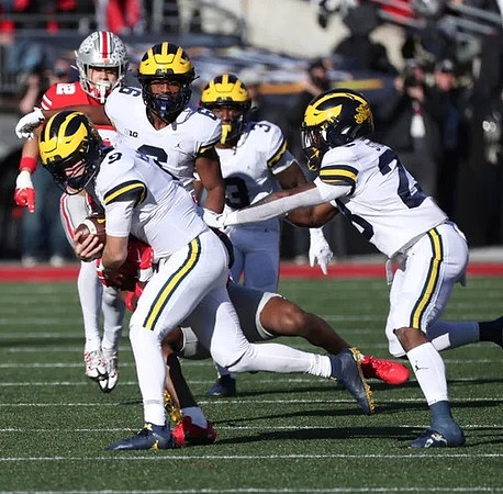 J.J. McCarthy (9), Cornelius Johnson (6), A.J. Henning (3), and Max Bredeson (82)
