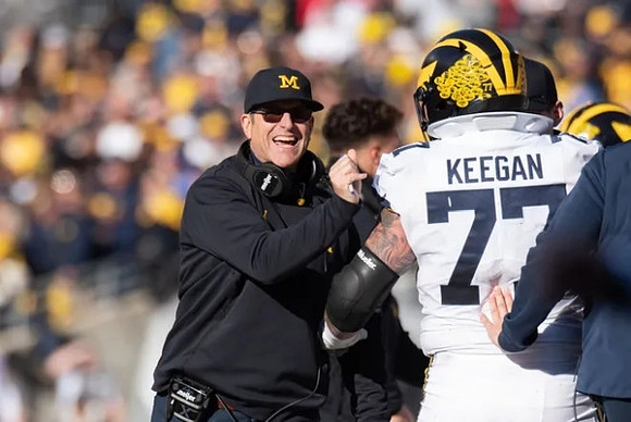 Jim Harbaugh and Trevor Keegan (77)