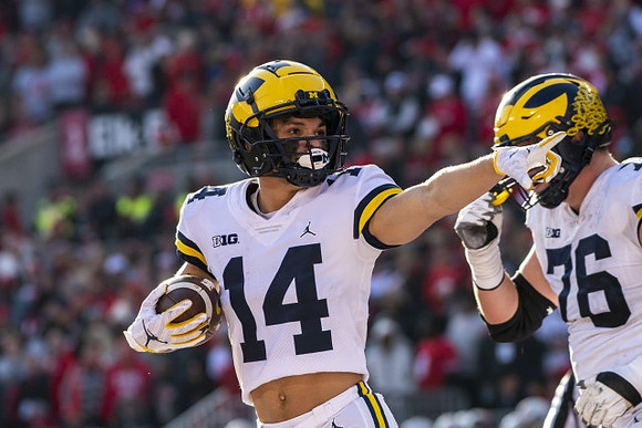 Roman Wilson (14) and Ryan Hayes (76)