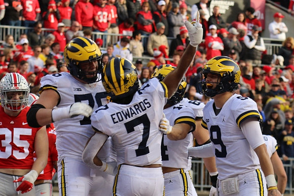 Ryan Hayes (76), Donovan Edwards (7), Roman Wilson (14), and J.J. McCarthy (9)