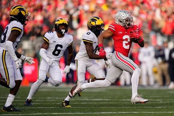 Rod Moore (19), R.J. Moten (6), and Mike Sainristil (0)