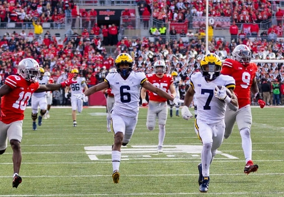 Luke Schoonmaker (86), Cornelius Johnson (6), and Donovan Edwards (7)