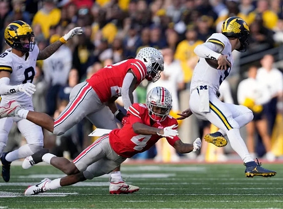 Ronnie Bell (8) and J.J. McCarthy (9)
