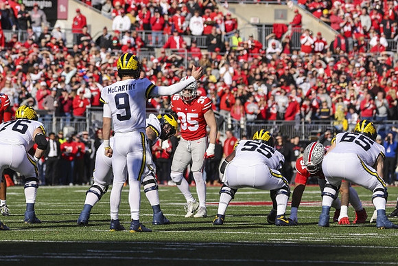 Ryan Hayes (76), J.J. McCarthy (9), Olusegun Oluwatimi (55), and Zak Zinter (65)