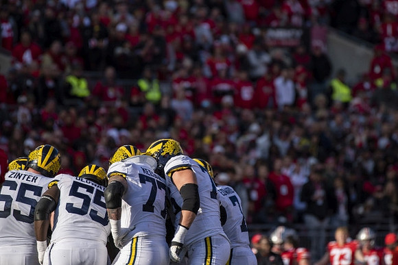 Zak Zinter (65), Olusegun Oluwatimi (55), Trevor Keegan (77), Ryan Hayes (76), and Donovan Edwards (7)