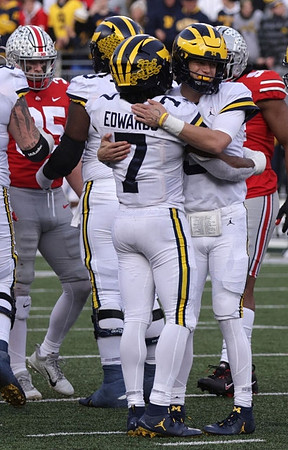 Donovan Edwards (7) and J.J. McCarthy (9)