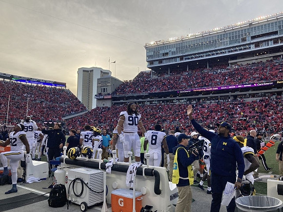 Mike Morris (90) and Michigan Team
