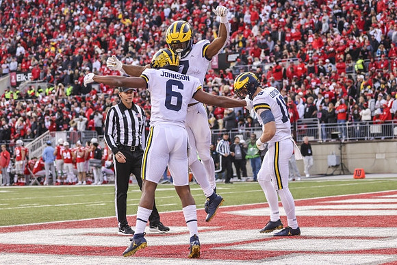 Cornelius Johnson (6), Donovan Edwards (7), and Colston Loveland (18)