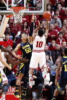 Jordan Morgan (52), Caris LeVert (23), and Derrick Walton Jr. (10)
