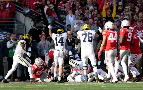 J.J. McCarthy (9), Roman Wilson (14), and Ryan Hayes (76)