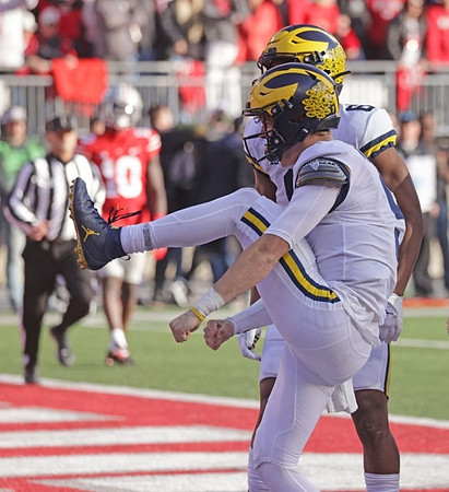 J.J. McCarthy (9) and Cornelius Johnson (6)