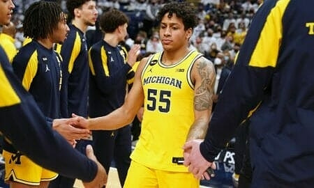 Eli Brooks (55) and Michigan Team