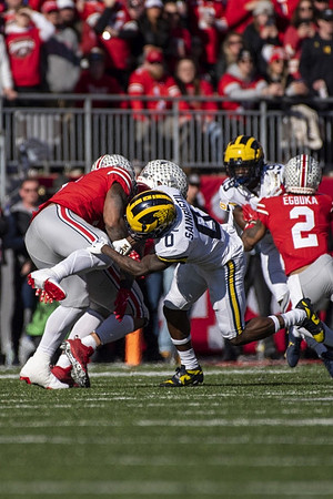 Mike Sainristil (0) and Rod Moore (19)
