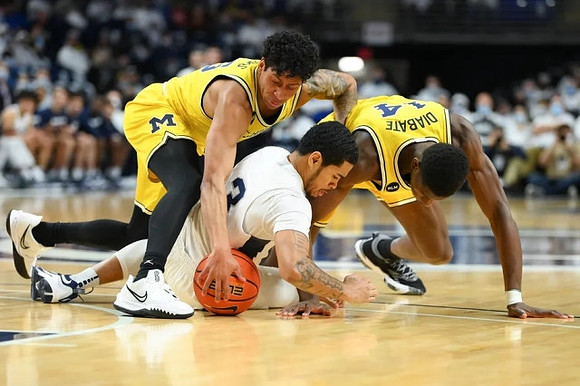 Eli Brooks (55) and Moussa Diabate (14)