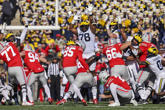 Kenneth Grant (78) and Mike Sainristil (0)