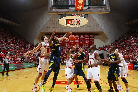 Derrick Walton Jr. (10), Zak Irvin (21), and Jon Horford (15)