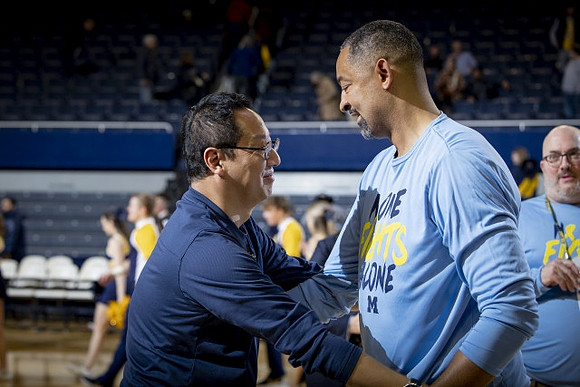 Michigan President Santa Ono  and Juwan Howard