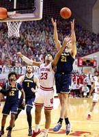 Mike Smith (12), Hunter Dickinson (1), and Franz Wagner (21)