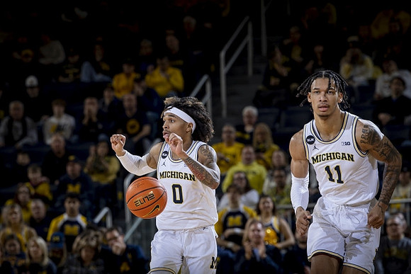 Dug McDaniel (0) and Isaiah Barnes (11)