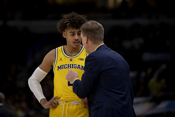Jordan Poole (2) and Luke Yaklich