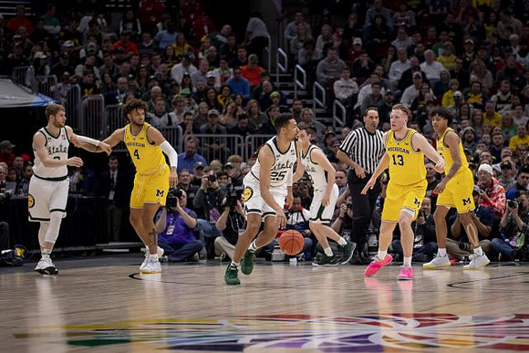Isaiah Livers (4), Ignas Brazdeikis (13), and Eli Brooks (55)