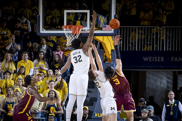 Tarris Reed Jr. (32) and Will Tschetter (42)