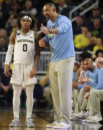 Dug McDaniel (0) and Juwan Howard