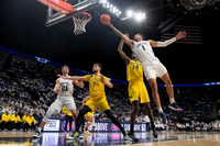 Hunter Dickinson (1) and Moussa Diabate (14)