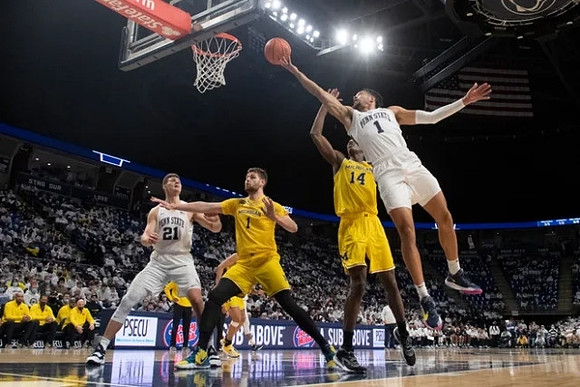 Hunter Dickinson (1) and Moussa Diabate (14)