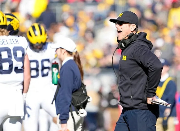 Carter Selzer (89), Luke Schoonmaker (86), and Jim Harbaugh