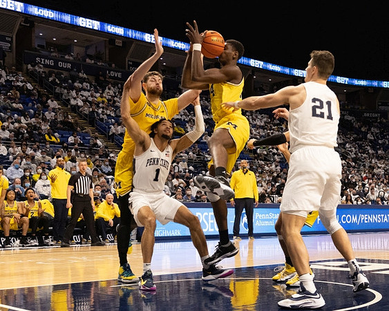 Hunter Dickinson (1) and Moussa Diabate (14)