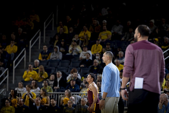 Juwan Howard and Minnesota Head Coach Ben Johnson