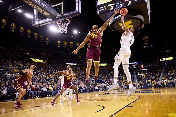 Tarris Reed Jr. (32) and Kobe Bufkin (2)