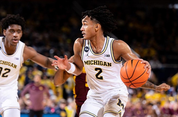 Tarris Reed Jr. (32) and Kobe Bufkin (2)