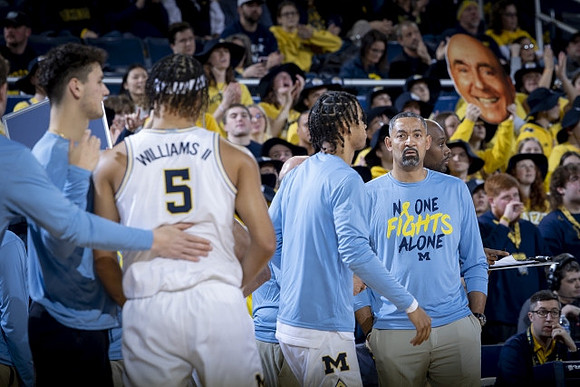 Terrance Williams II (5), Juwan Howard, and Michigan Team