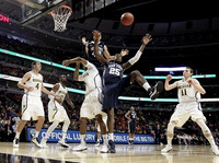 Mitch McGary (4), Tim Hardaway Jr. (10), Glenn Robinson III (1), and Nik Stauskas (11)