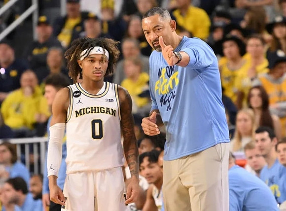Dug McDaniel (0) and Juwan Howard