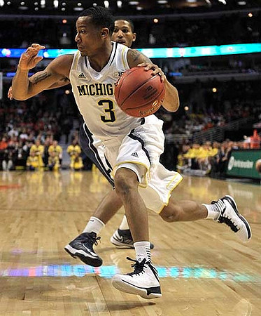 Jordan Morgan (52), Mitch McGary (4), and Nik Stauskas (11)